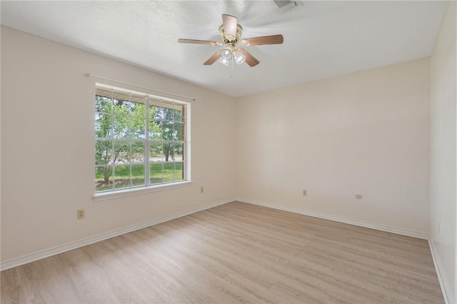 1905 Nueces Dr, College Station, TX 77840 - empty room with light wood-type flooring and a ceiling fan
