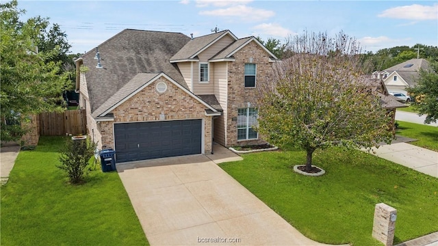 view of front of house with a front yard and a garage