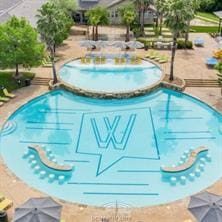 view of swimming pool with a water play area