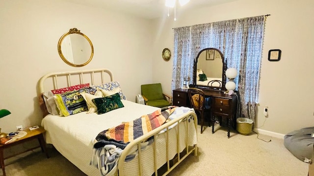 bedroom with carpet floors and baseboards