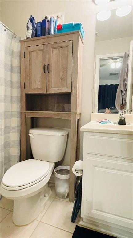 bathroom featuring vanity, toilet, and tile patterned floors