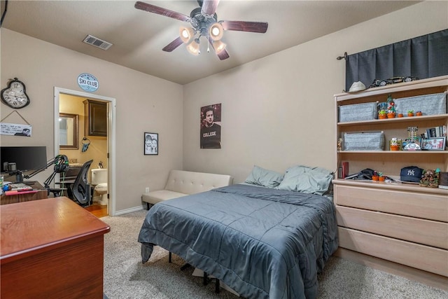 bedroom featuring ceiling fan, carpet, and ensuite bathroom