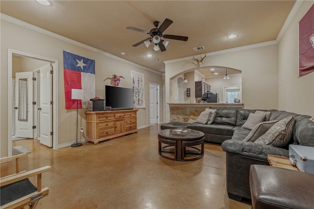 living room with ceiling fan and crown molding