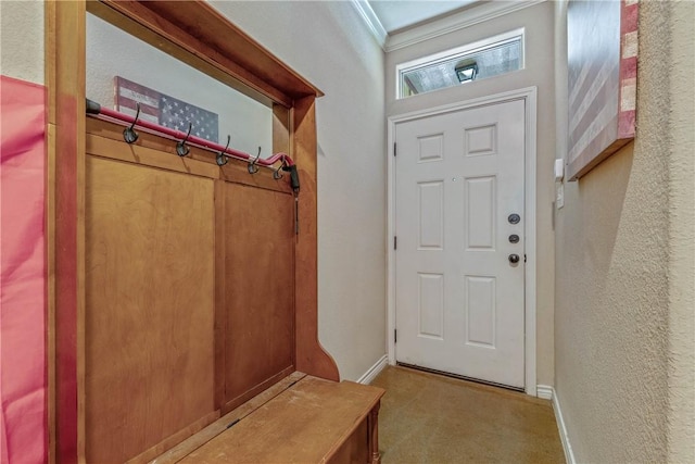 mudroom featuring light colored carpet and crown molding