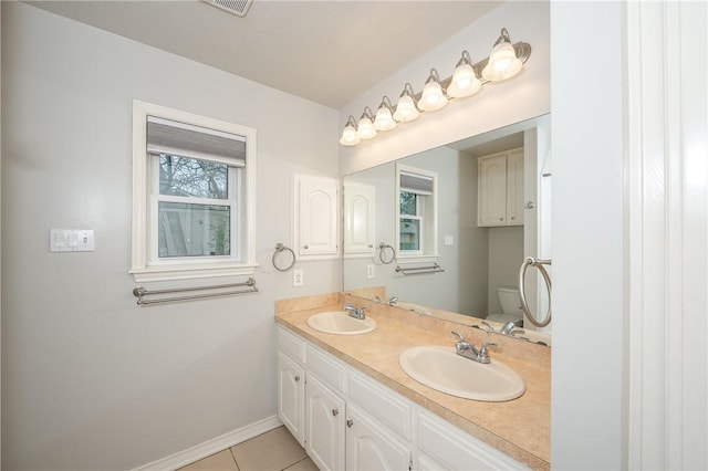 full bathroom featuring baseboards, a sink, toilet, and tile patterned floors