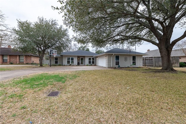 single story home featuring a garage, a front yard, driveway, and fence