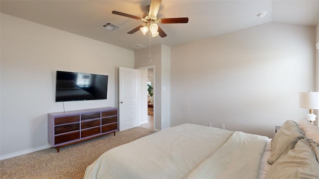 bedroom featuring vaulted ceiling, light colored carpet, and ceiling fan