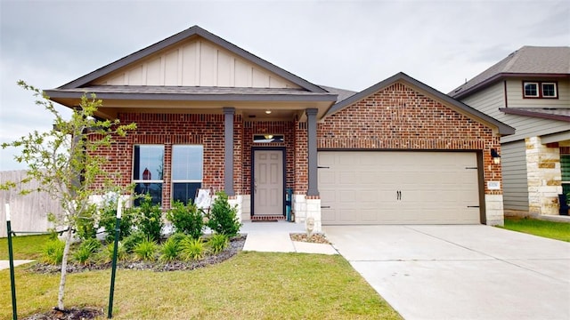 craftsman-style house featuring a garage and a front lawn