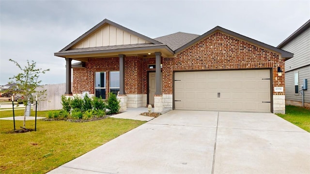 view of front facade featuring a garage and a front lawn