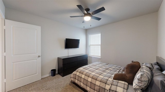 bedroom with light carpet and ceiling fan