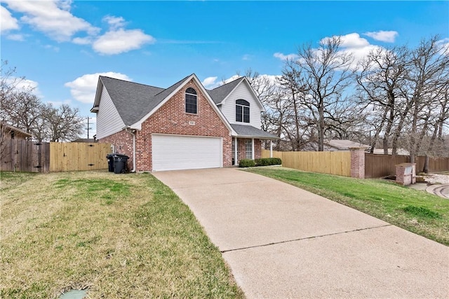 traditional-style home with fence, driveway, a gate, brick siding, and a front yard