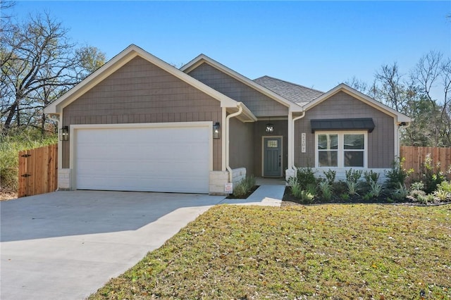 view of front of home with a garage and a front lawn