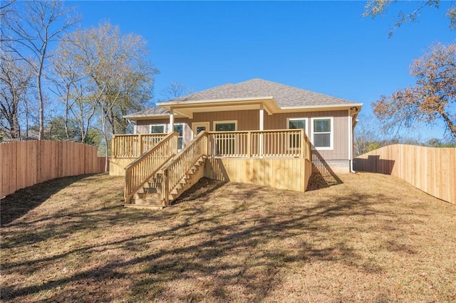 rear view of property featuring a deck