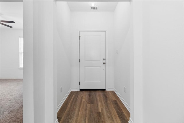 hallway with dark wood-type flooring