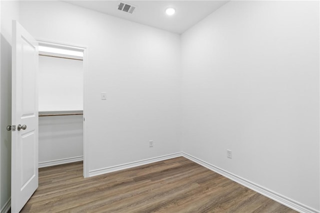 spare room with dark wood-type flooring