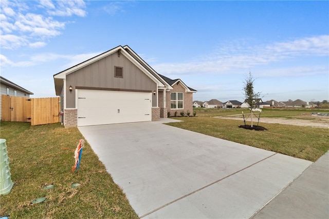 view of front of home with a garage and a front lawn