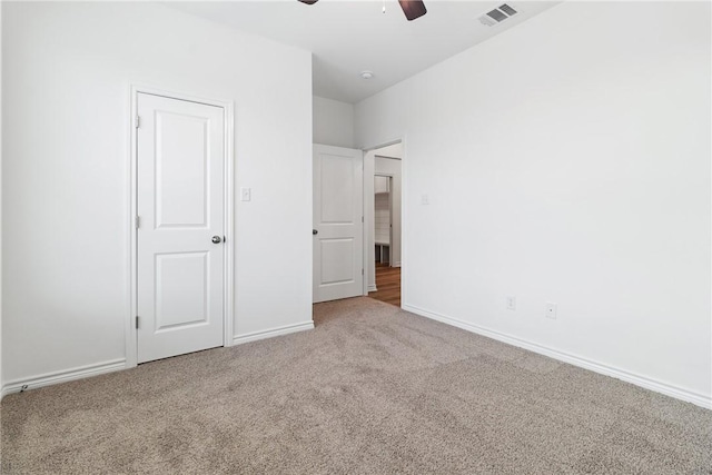 unfurnished bedroom featuring carpet and ceiling fan