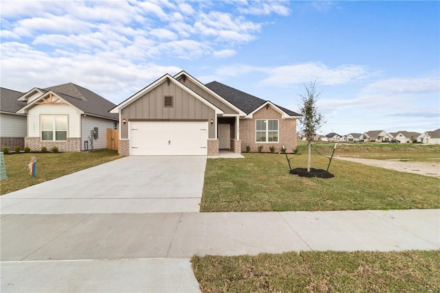 view of front of property featuring a garage and a front lawn