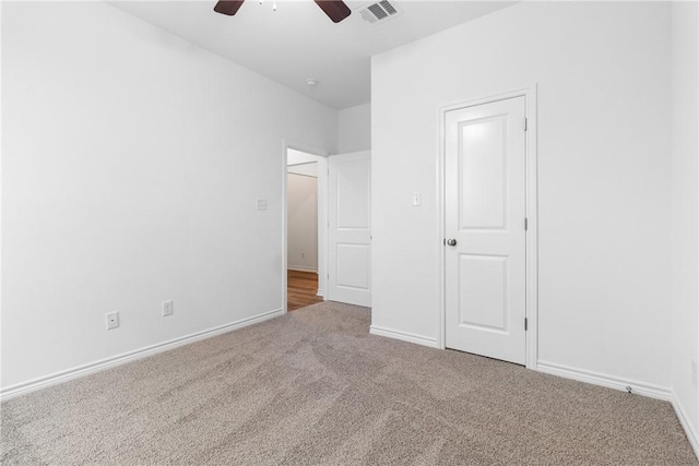 unfurnished bedroom featuring carpet flooring and ceiling fan