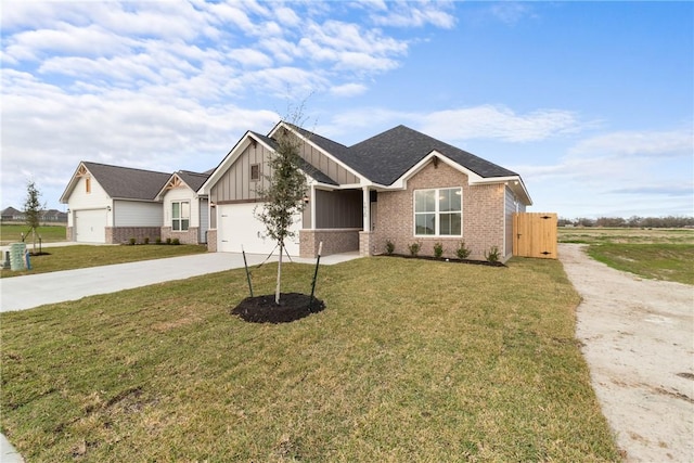 view of front of property with a front yard and a garage