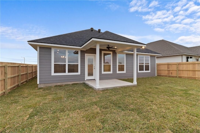 back of house featuring a patio, ceiling fan, and a lawn