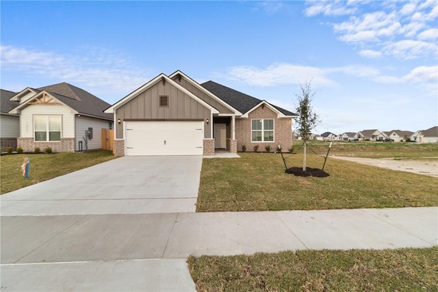 view of front of property with a garage and a front lawn