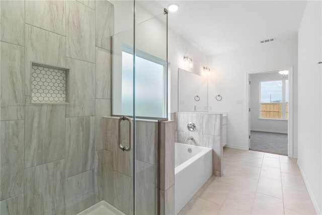 bathroom with tile patterned floors, vanity, and independent shower and bath