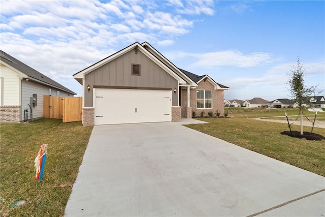 view of front of house featuring a garage and a front yard