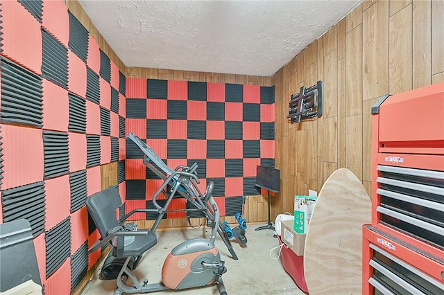 interior space featuring concrete floors and a textured ceiling