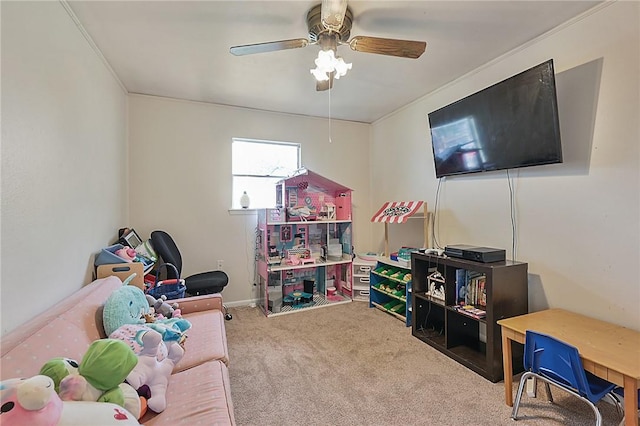 game room featuring carpet flooring, ceiling fan, and ornamental molding