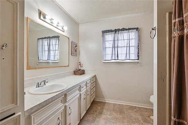 bathroom featuring tile patterned flooring, vanity, toilet, and a textured ceiling