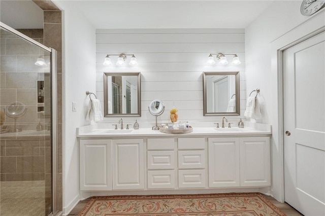 5046 Mooney Falls Dr, Bryan, TX 77802 - bathroom featuring a shower stall and double vanity