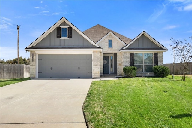 craftsman-style home with board and batten siding, a front yard, brick siding, and fence