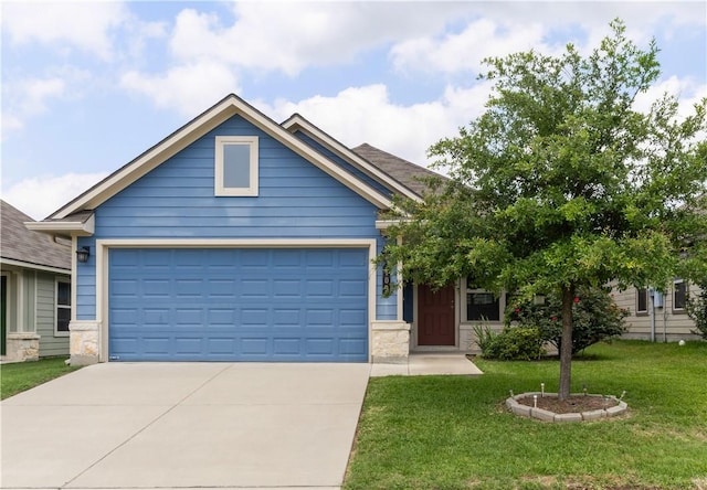 109 Dove Ct, Navasota, TX 77868 - view of front of house featuring concrete driveway, a front yard, a garage, and stone siding