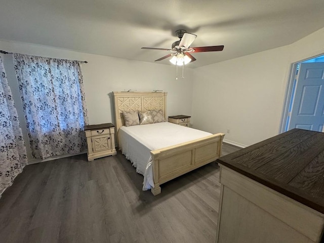 bedroom with ceiling fan and dark wood-type flooring