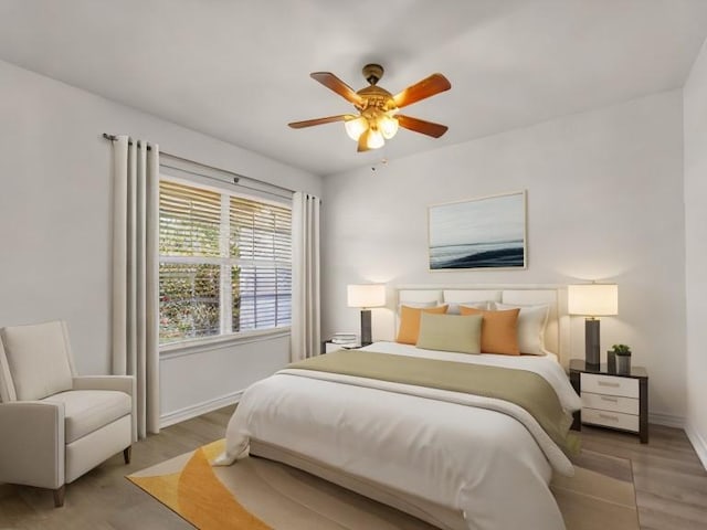 bedroom featuring wood-type flooring and ceiling fan