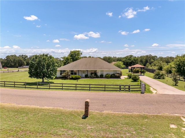 view of property's community featuring a gazebo, a yard, and a rural view