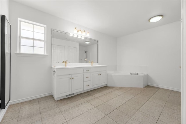 bathroom with vanity, tile patterned floors, and a bathing tub