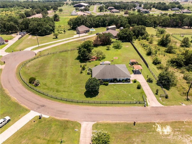 birds eye view of property with a rural view