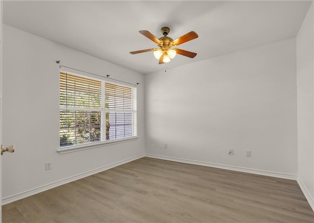 spare room with ceiling fan and light hardwood / wood-style flooring