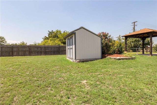 view of yard featuring a gazebo and a shed