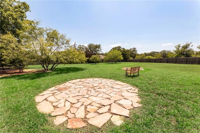 view of yard with a patio and a fire pit