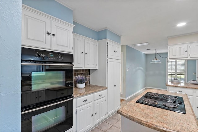 kitchen featuring backsplash, black appliances, pendant lighting, white cabinetry, and light tile patterned flooring