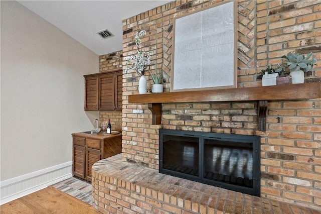 room details featuring hardwood / wood-style floors and a fireplace