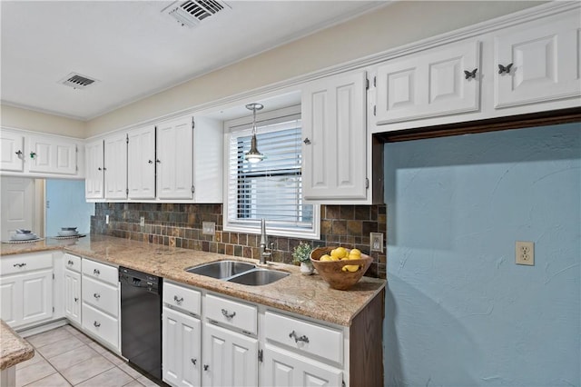 kitchen featuring tasteful backsplash, white cabinetry, sink, and black dishwasher