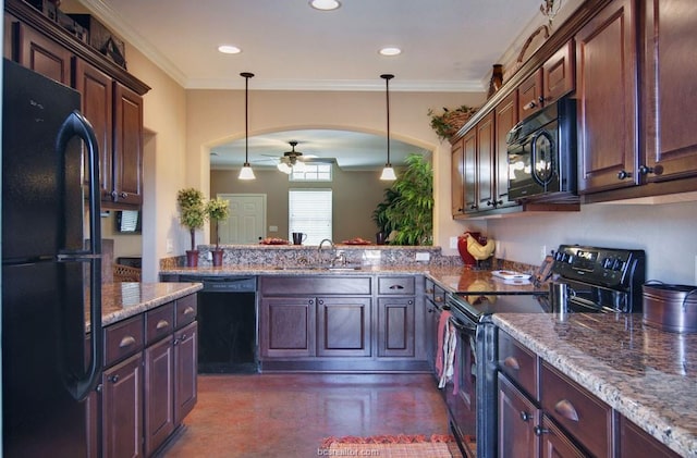 kitchen with hanging light fixtures, sink, kitchen peninsula, and black appliances