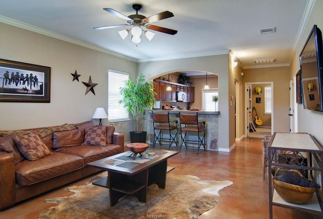 living room featuring crown molding and ceiling fan