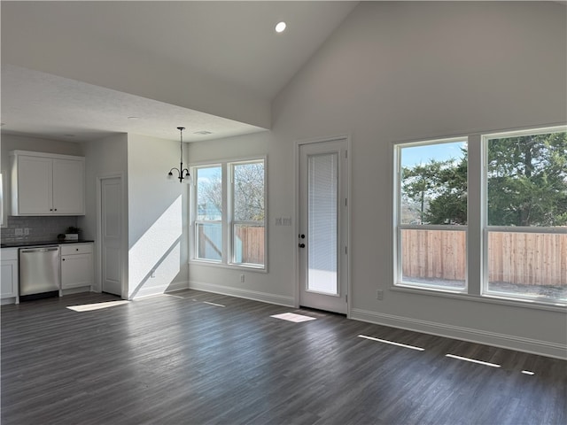 doorway featuring dark hardwood / wood-style flooring and high vaulted ceiling