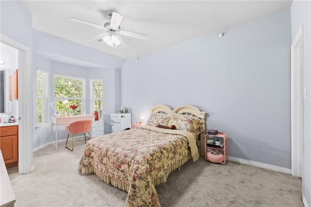 bedroom with light carpet, baseboards, and a ceiling fan