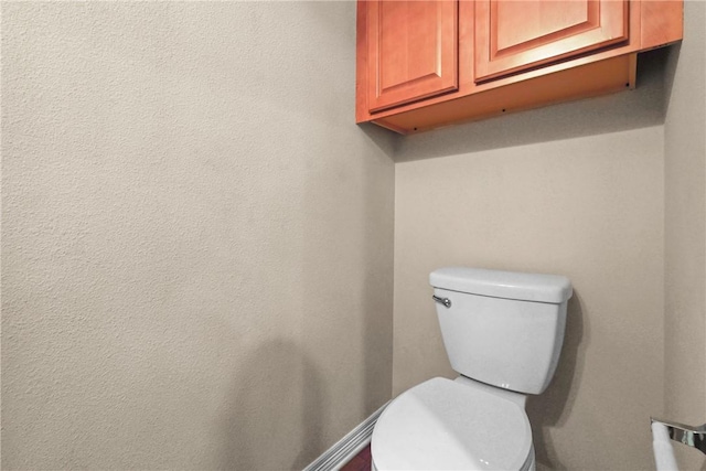 bathroom featuring toilet